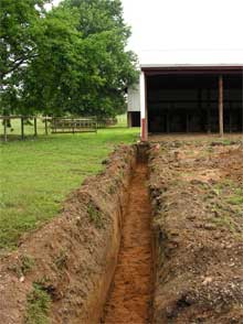 The initial trench along south side of the paddock area.